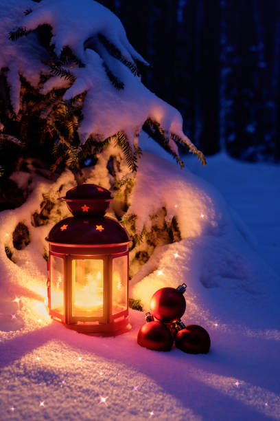 istock Christmas flashlight with toys in the forest under the Christmas tree. Winter's tale on Christmas eve 1036999442