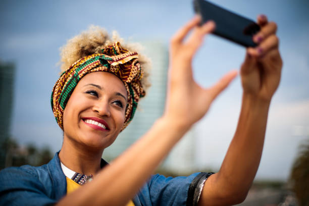 istock Smiling woman making selfie. 1037026570
