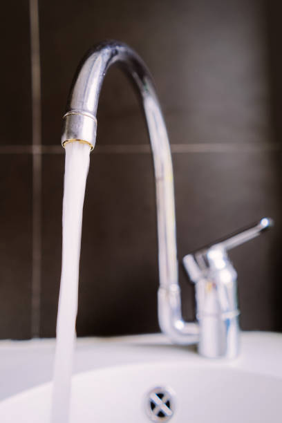 istock Metal tap and water closeup 1037026970