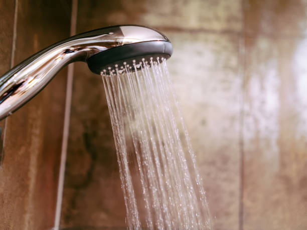 istock Shower head and running water 1037027080