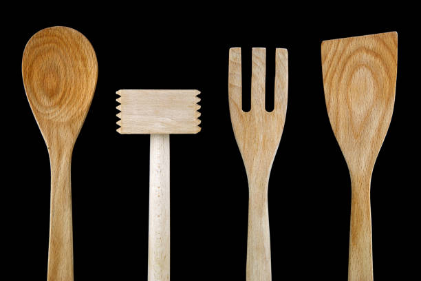 istock Wooden Kitchen Utensils Isolated on Black 1037032732