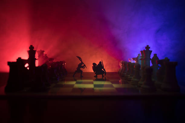 istock Medieval battle scene with cavalry and infantry on chessboard. Chess board game concept of business ideas and competition and strategy ideas Chess figures on a dark background 1037035686