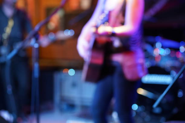 istock Guitar player on the stage - out of focus 1037044414