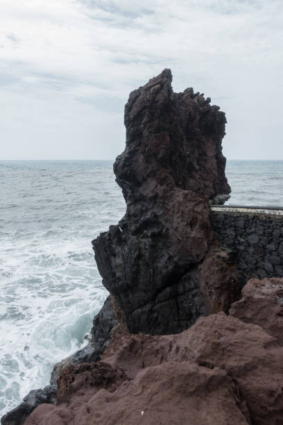 istock Rock end of Ponta do Sol pier bridge in Madeira 1037058632