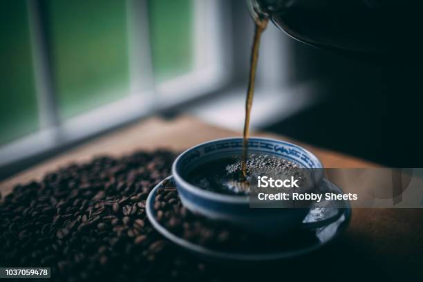 A Cup Of Coffee Being Poured Stock Photo - Download Image Now - 2015, Art, Brown