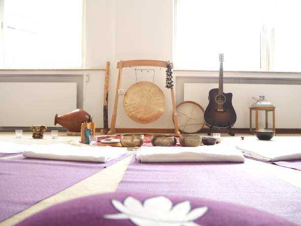 istock Sound therapy set up with different sound instruments and yoga mats around. 1037065286