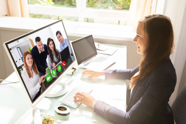 istock Businesswoman Videoconferencing With Her Colleagues On Computer 1037076578