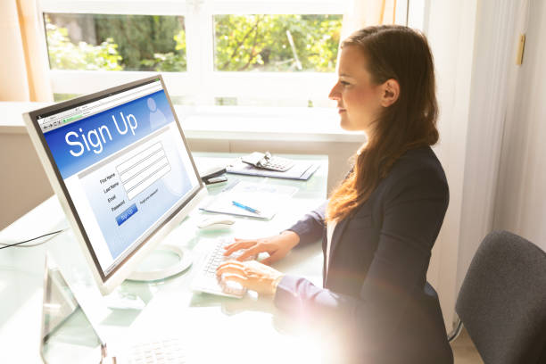istock Businesswoman Signing Into Website On Computer 1037076590