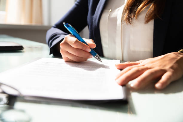istock Businesswoman Filling Contract Form 1037076676