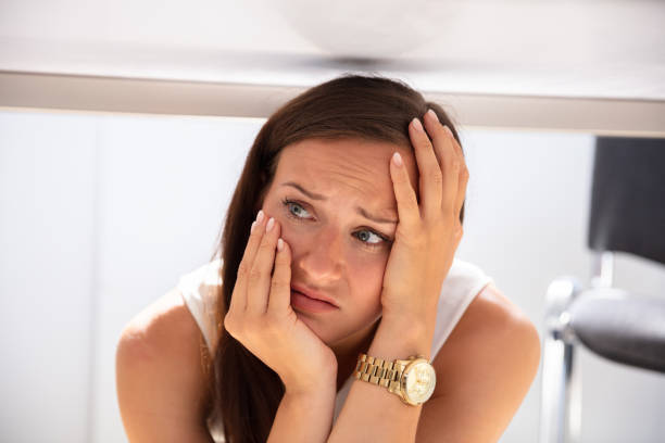 istock Businesswoman Hiding Under Desk 1037076750