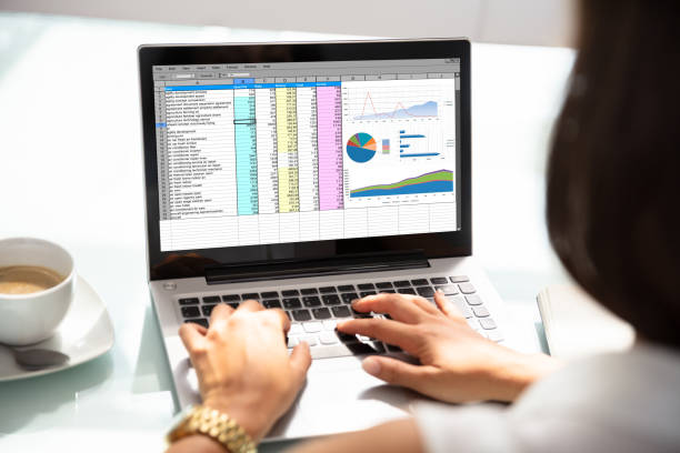 istock Businesswoman Working With Spreadsheet On Laptop 1037076772