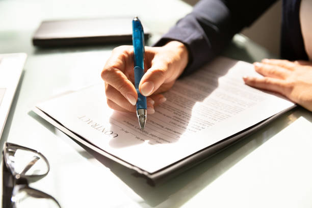 istock Businesswoman Filling Contract Form 1037076894
