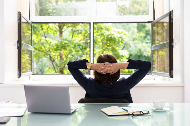 istock Relaxed Businesswoman Sitting In Office 1037076946