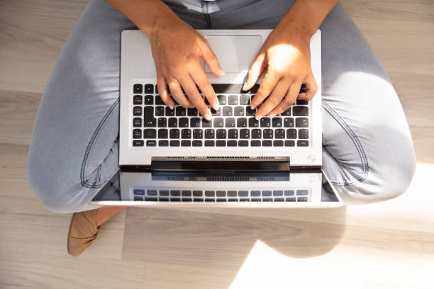 istock Woman Typing On Laptop Keypad 1037080270