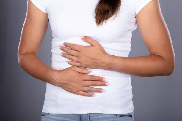 istock Young Woman Suffering From Stomach Pain 1037080316
