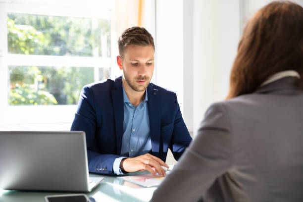 istock Businessman Looking At Job Candidate 1037082152
