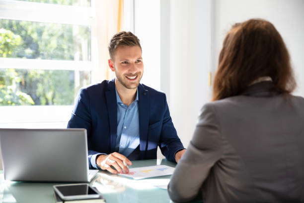 istock Businessman Looking At Job Candidate 1037082198