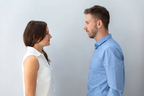 istock Two Businesspeople Looking At Each Other 1037082434