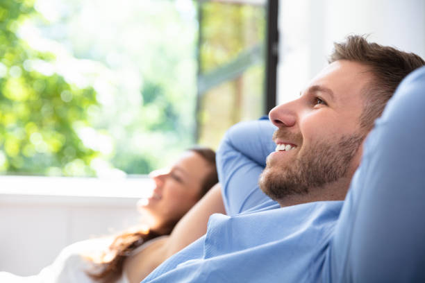 istock Couple Relaxing At Home 1037082486