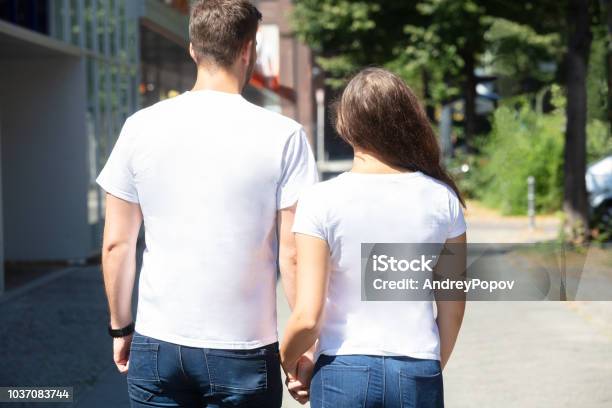 Rear View Of A Young Couple Stock Photo - Download Image Now - Back, Hipster Culture, Shirt