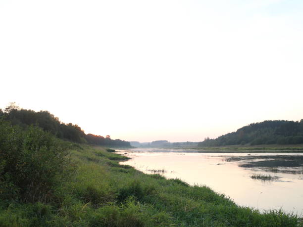 istock picturesque river bank at sunset 1037087922
