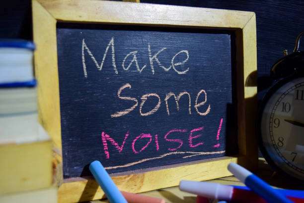 istock Make some noise! on phrase colorful handwritten on blackboard. 1037090342