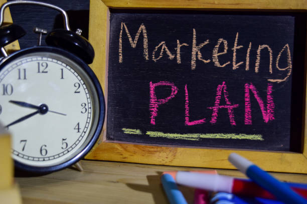 istock Marketing plan on phrase colorful handwritten on blackboard. 1037090478