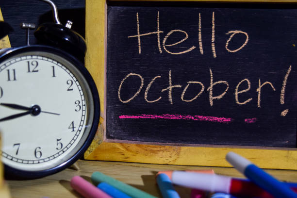 istock Hello october on phrase colorful handwritten on blackboard. 1037090574