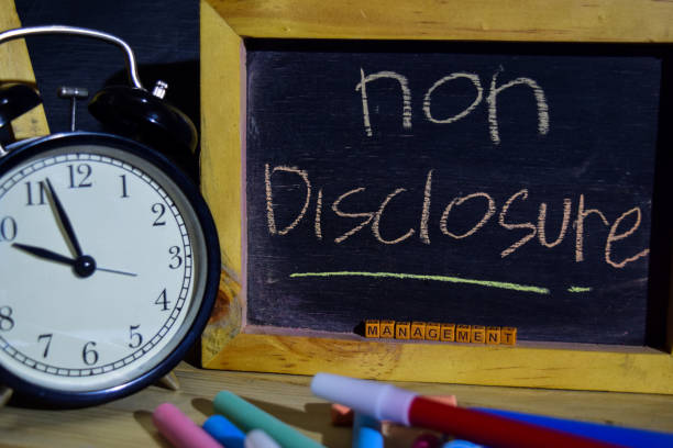 istock Non disclosure management on phrase colorful handwritten on blackboard. 1037090604