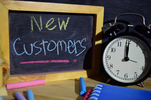 istock New Customers on phrase colorful handwritten on blackboard. 1037090774