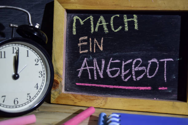 istock Mach ein angebot in germany on phrase colorful handwritten on blackboard. 1037090868