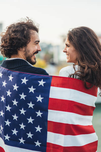 istock Happy couple under  American flag 1037091152