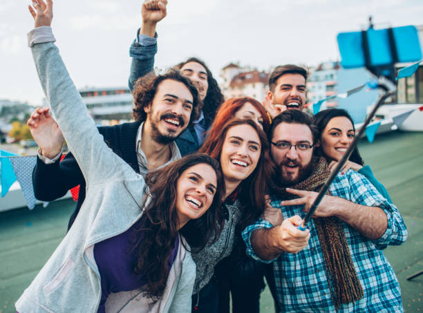 istock Friends taking selfie on the rooftop 1037091160