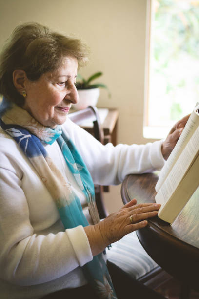 istock Mature woman reading and studying 1037097622