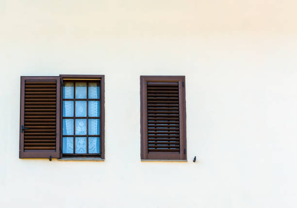 istock typical italian shutter and windows to white wall 1037115766
