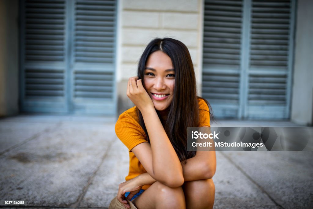 Portrait of a beautiful smiling woman. Portrait of a beautiful smiling Chinese woman looking at the camera Asia Stock Photo