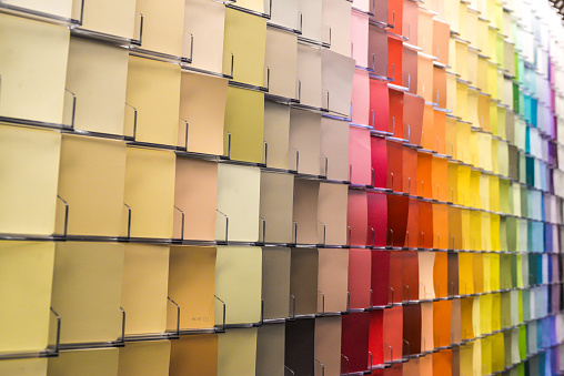 Colorful background image of paint color choices swatches a rainbow of possibility