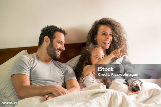 Dad Mom And Daughter In Bed Stock Photo - Download Image Now - Bed - Furniture, Family, Latin American and Hispanic Ethnicity