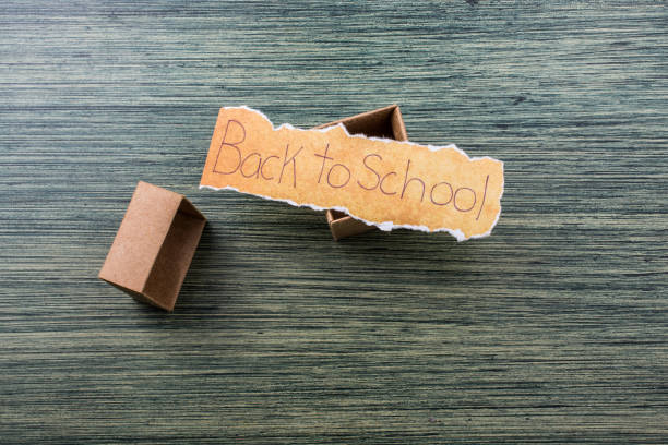 istock Back to school wording on  torn paper 1037164370