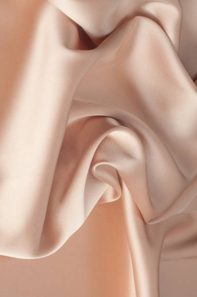 istock tissue, textile, cloth, fabric, material, texture. beige color 1037164572