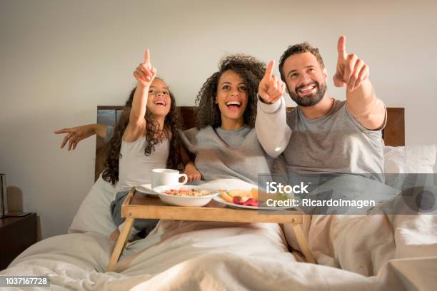 Family Having Breakfast In Bed Stock Photo - Download Image Now - 6-7 Years, Adult, Arab Culture