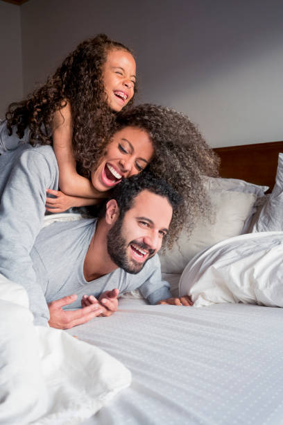 istock Family playing in bed 1037168188