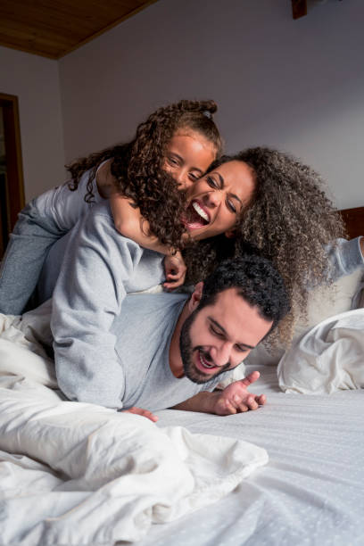 istock Family playing in bed 1037168854
