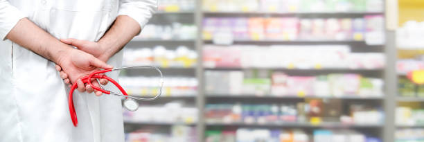 Male pharmacist working at the pharmacy.