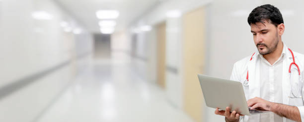 istock Doctor using laptop computer at the hospital. 1037178180