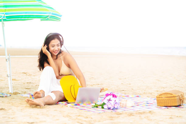istock Plus size young woman sitting on the beach. 1037179588