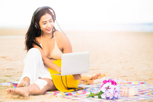 istock Plus size young woman sitting on the beach. 1037179604