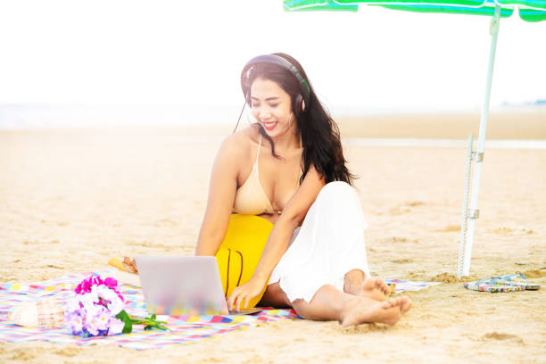 istock Plus size young woman sitting on the beach. 1037179616