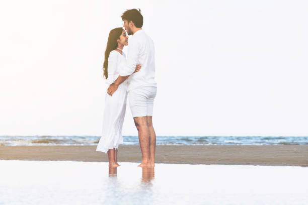 istock Couple going honeymoon on tropical beach in summer 1037180442