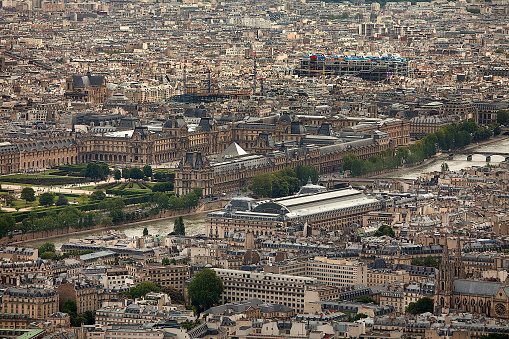 An aerial view of Paris, France on foggy winter morning with The golden dome church of Les Invalides.